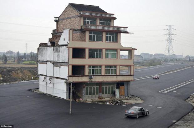 Motorway Built Around Couple's Home In China.
