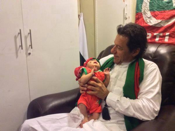Imran Khan With One Of The Youngest PTI Supporter
