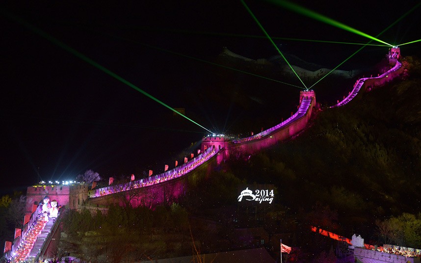 A lightshow illuminates the Great Wall