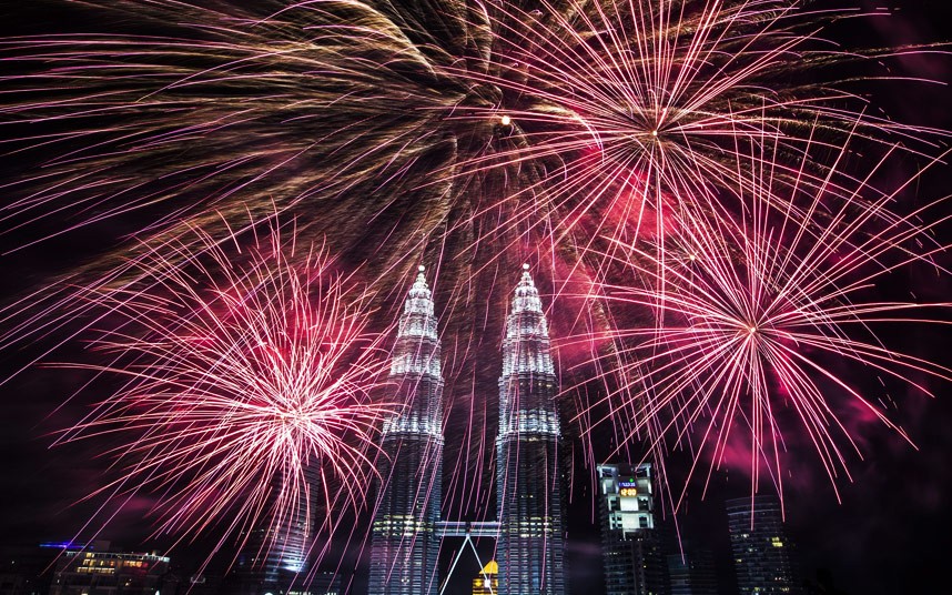 Fireworks explode near Malaysia's landmark, Petronas Towers in Kuala Lumpur, Malaysia