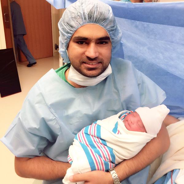 Asad Bashir With His Newborn Daughter