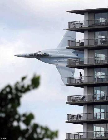 Crazy fighter jet flyby an apartment building