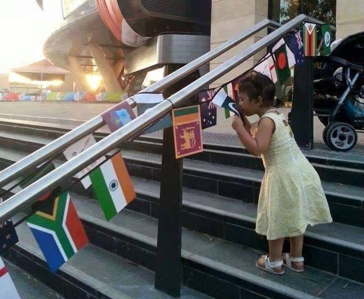 Little Girl Kissing Pakistani Flag On Stairs