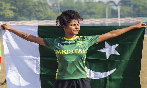Pakistan Women's Football Captain Hajra Khan Poses With Pakistan's Flag