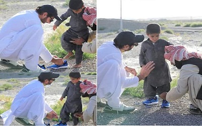 Shahid Afridi Winning The Hearts In Balochistan, Making The Kid Wear Shoes