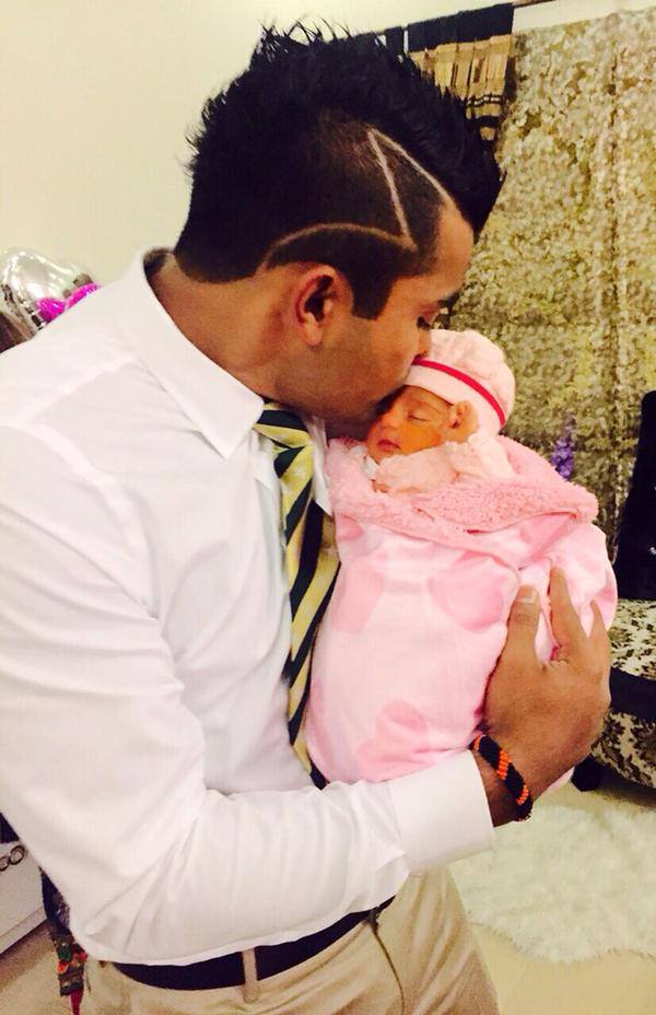 Umar Akmal With Daughter Before Leaving For World Cup 2015
