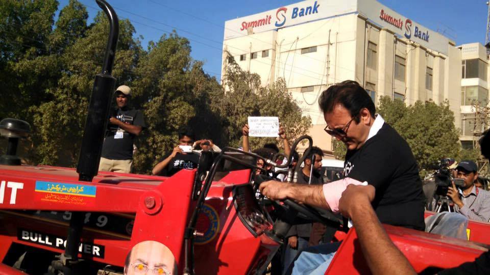 Behroz Sabzwari driving ‪fixit‬ tractor