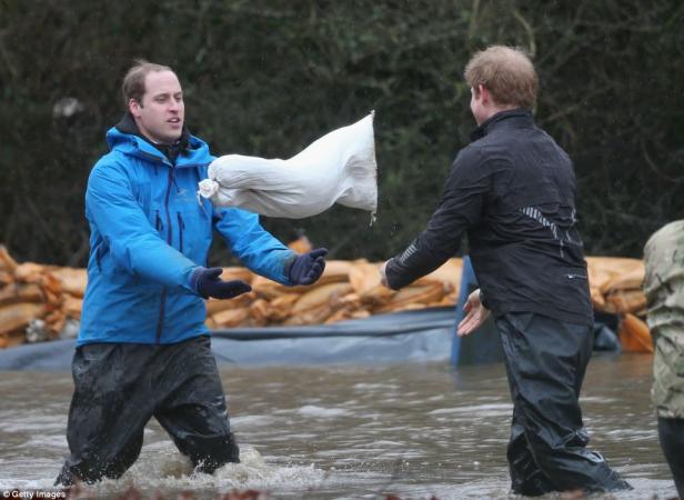 Prince William and Prince Harry Helping In Flood